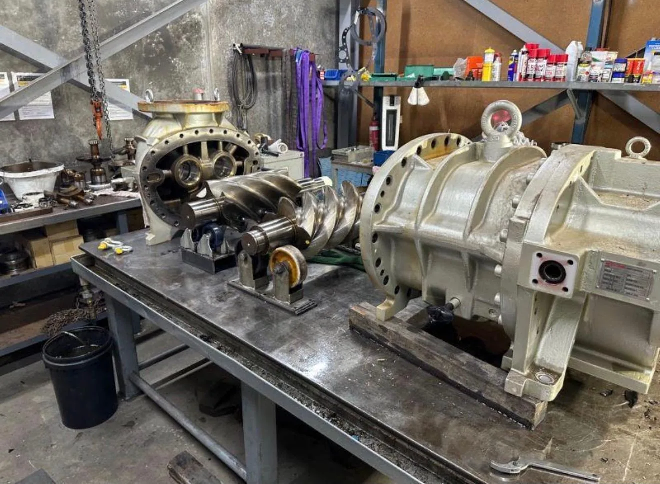 Compressor housing, rotors and bearing pedestals on the bench.